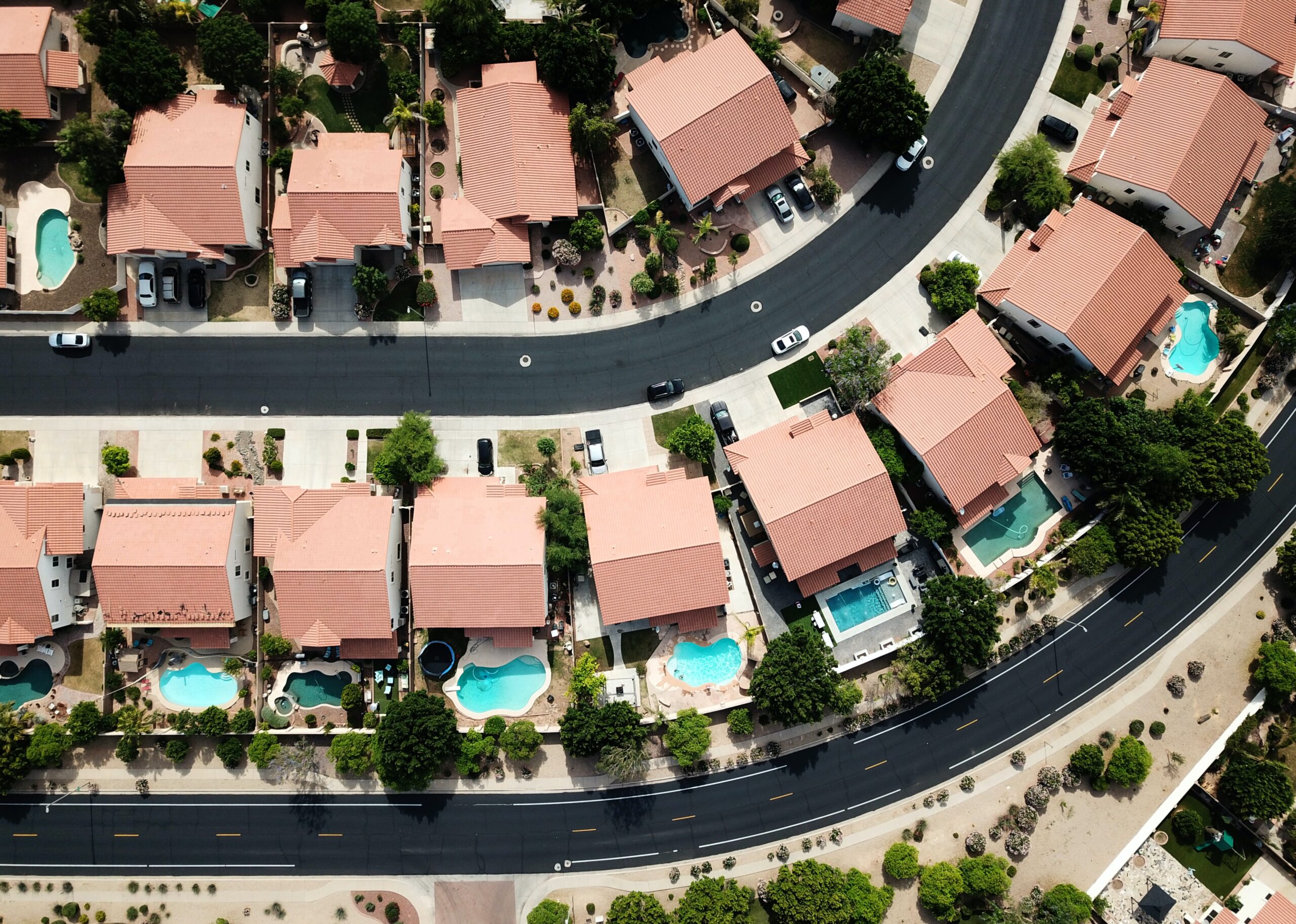 bird's eye view of the gated community developed by a real estate group for selling.