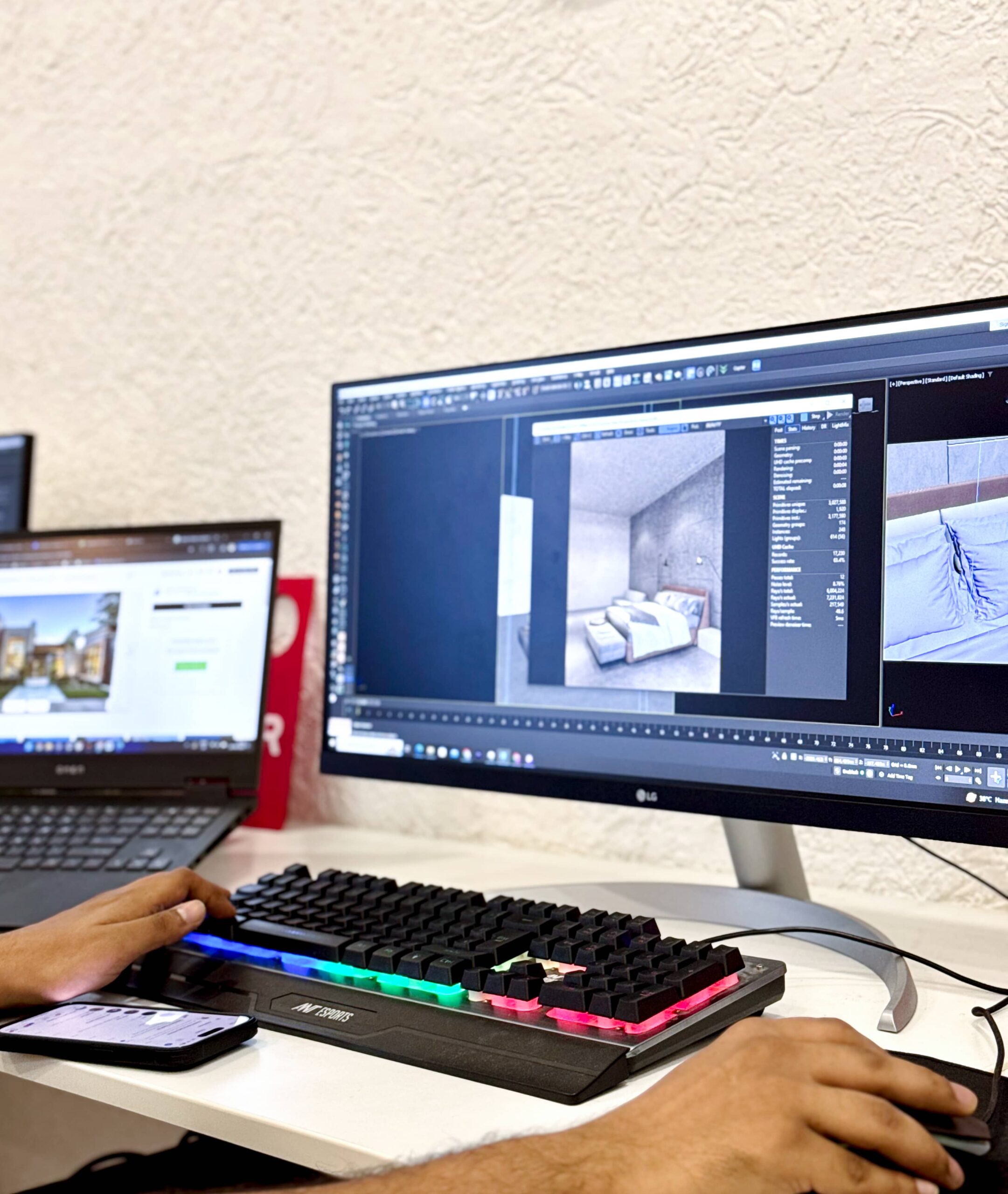 A 3D artist working on an interior design project in 3ds Max, adjusting models and lighting on a desktop.