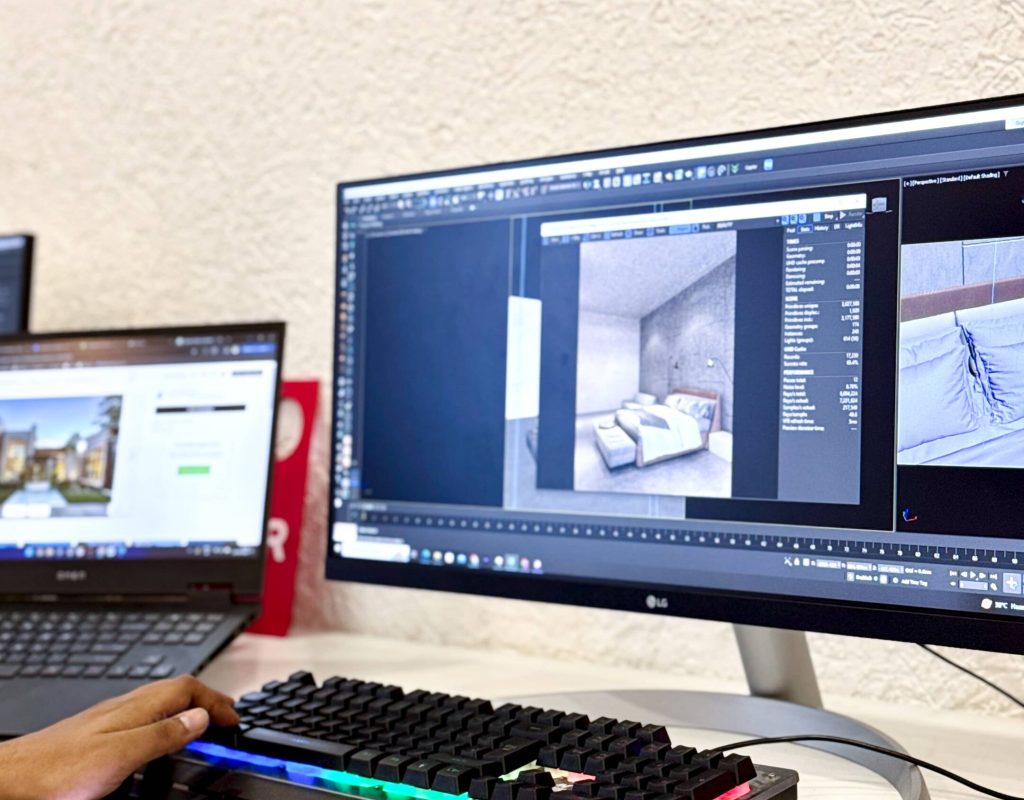 A 3D artist working on an interior design project in 3ds Max, adjusting models and lighting on a desktop.